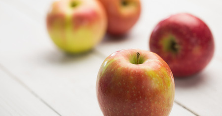 Fresh red apples on wooden backgroundの写真素材