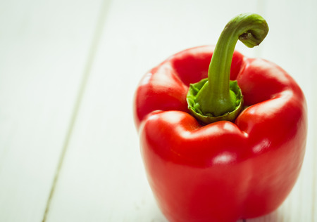 Red pepper on wooden backgroundの写真素材