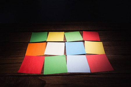 Colorful sticky post its on wooden backgroundの写真素材