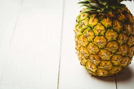 Fresh pineapple on wooden background