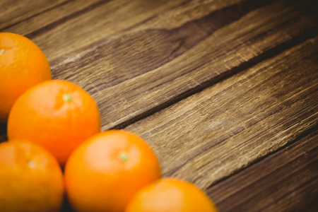 Fresh oranges on wooden backgroundの写真素材