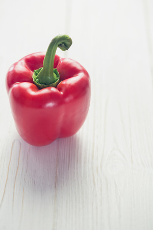 Red pepper on wooden backgroundの写真素材