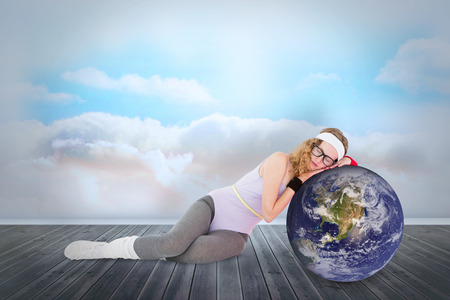 Fit nerd against clouds in a roomの写真素材