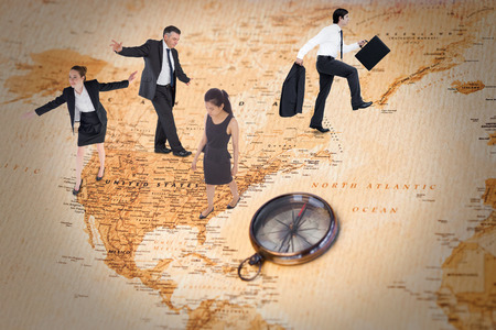Businesswoman performing a balancing act against world map with compass showing north americaの写真素材