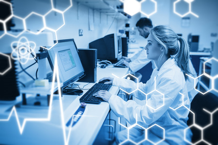 Science graphic against food scientist using technology to analyse cheeseの写真素材