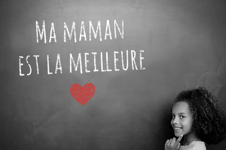 French mothers day message against schoolchild with blackboardの写真素材