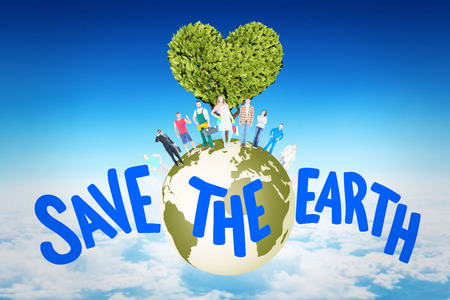 People standing on the world against blue sky over clouds at high altitudeの写真素材