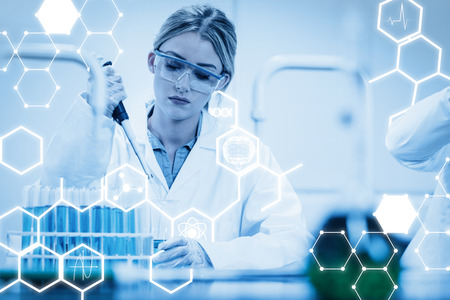 Science graphic against science student using pipette in the labの写真素材