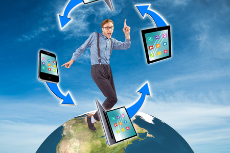 Geeky hipster dancing to vinyl against blue skyの写真素材