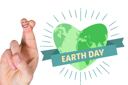 Smiling fingers against earth day graphic