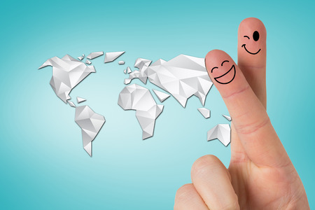 Fingers smiling against blue vignette backgroundの写真素材