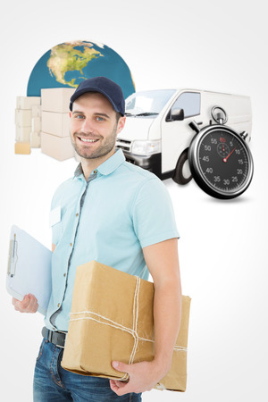 Portrait of happy courier man with parcel against logistics graphicの写真素材