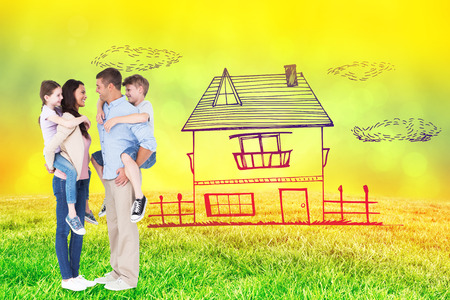 Side view of parents giving piggyback ride to children against field against glowing lightsの写真素材