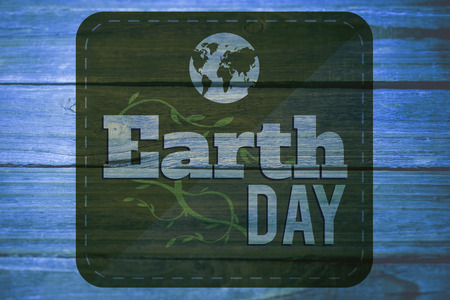 Earth Day Graphic against wooden backgroundの写真素材