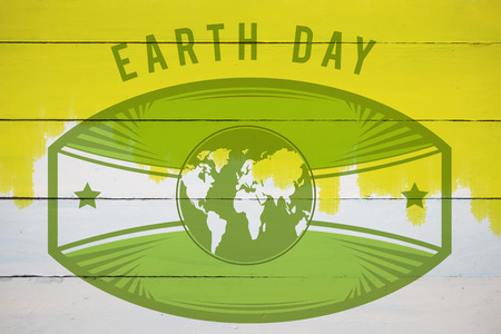Earth Day Graphic against yellow paint on fenceの写真素材