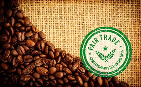 Fair Trade graphic against coffee beans and burlap sackの写真素材
