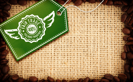 Fair Trade graphic against frame of coffee beansの写真素材