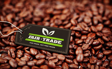 fair trade stamp against coffee beansの写真素材