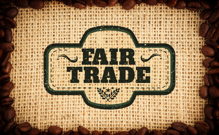 Fair Trade graphic against frame of coffee beansの写真素材