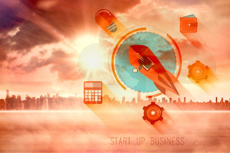 start up business graphic against sun shining over cityの写真素材
