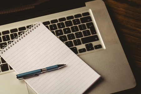 Notepad on laptop on a desk