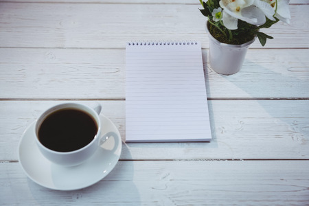Overhead shot of notepad on a deskの写真素材