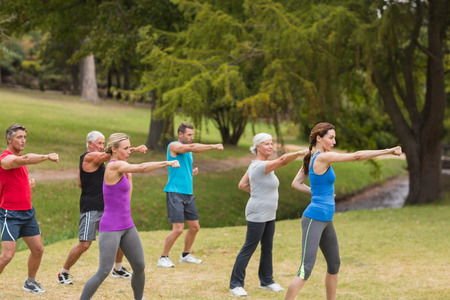Athletic group showing their fists on a sunny day