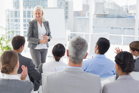 Businesswoman doing speech during meeting in office Businesswoman doing speech during meeting in office