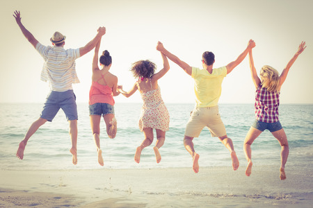 group of friends having fun at the beachの写真素材