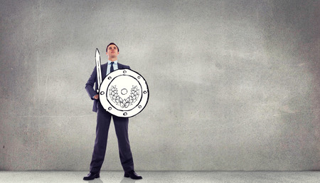 Corporate warrior against grey roomの写真素材