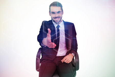 Smiling businessman on an chair office offering handshake against server room with towersの写真素材