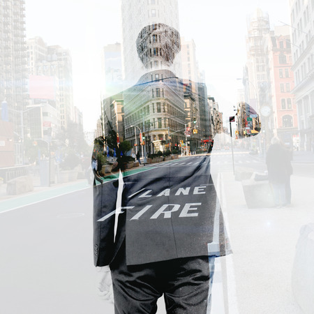 Asian businessman pointing against new york streetの写真素材