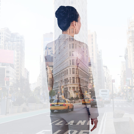 Asian businesswoman against new york streetの写真素材