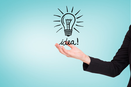 Businesswomans arm presenting against blue vignette backgroundの写真素材