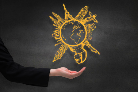 Businesswomans hand presenting against black wallの写真素材