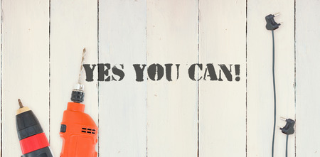 The word yes you can! against diy tools on wooden backgroundの写真素材