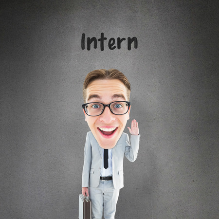 Geeky businessman  against grey roomの写真素材