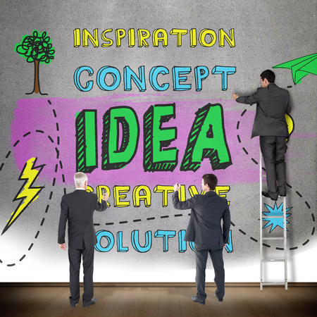 Business team writing against grey roomの写真素材