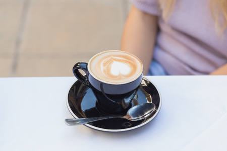 Close up of cup of coffee on table