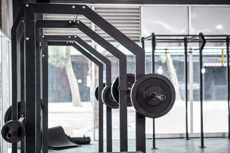 Side view of barbells in crossfit gym