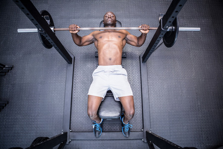 Young Bodybuilder doing weightlifting in the crossfit gym