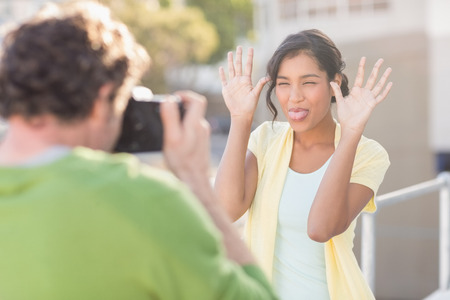 couple taking photos of themselves during the summerの写真素材