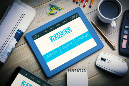 homepage against tablet on desk