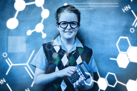 Science graphic against portrait of cute little girl holding calculatorの写真素材