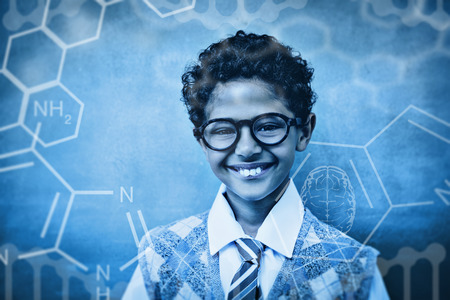 Science graphic against cute little boy smiling in classroom