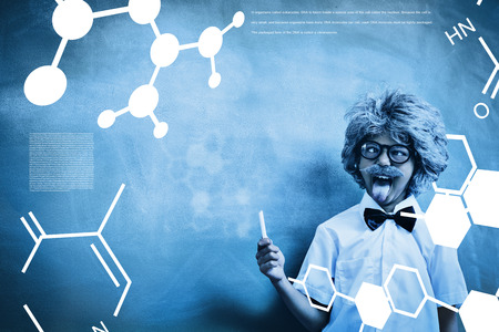Science graphic against boy dressed as senior teacher in front of blackboardの写真素材