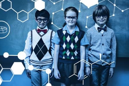 Science graphic against smiling little school kids in classroomの写真素材