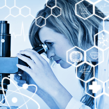 Attractive blonde scientist looking through a microscope against science graphic