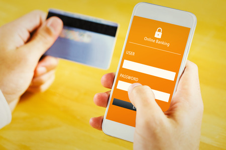 Businessman using smartphone against online bankingの写真素材