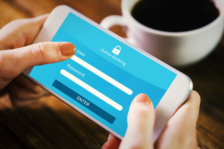 Woman using smartphone against online bankingの写真素材